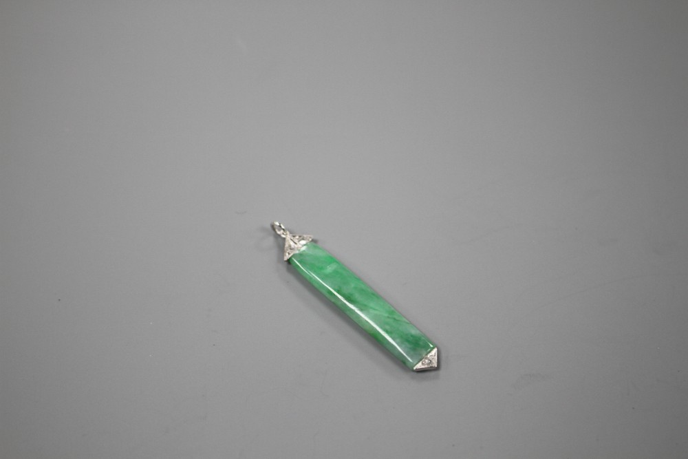A 1920s style white metal mounted, jade and diamond pendant, overall 38mm, gross weight 1.7 grams.